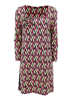 Dress with geometric patterned brooch